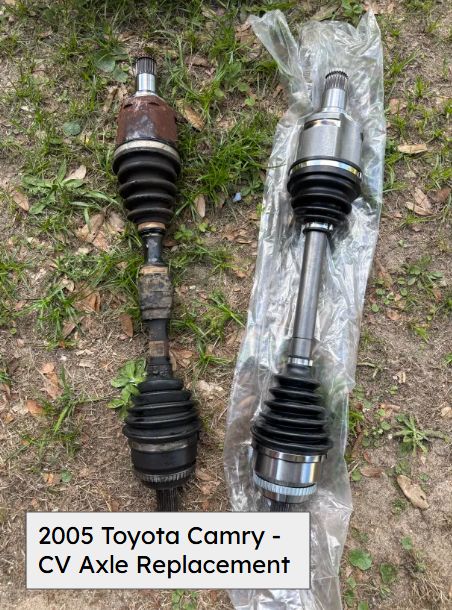 Old and new CV axles laid on the grass, from a 2005 Toyota Camry
