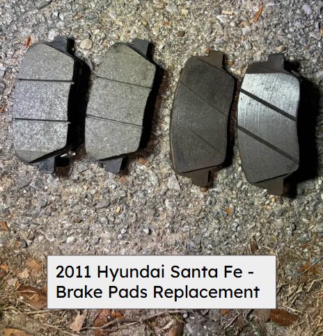 Four worn brake pads laid next to four new pads on the ground, from a 2011 Hyundai Santa Fe