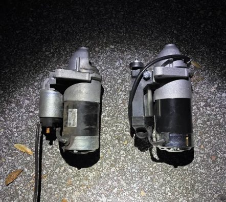 Old and new starter motors side by side from a 2011 Nissan Titan