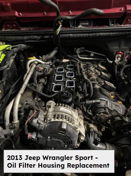 Engine bay of a 2013 Jeep Wrangler Sport after the oil filter housing repair