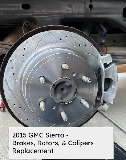 New drilled and slotted rear brake rotor and caliper installed on a 2015 GMC Sierra