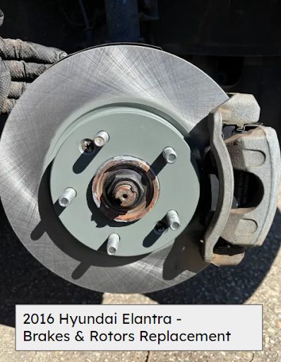 New front brake rotor and caliper installed on a 2016 Hyundai Elantra